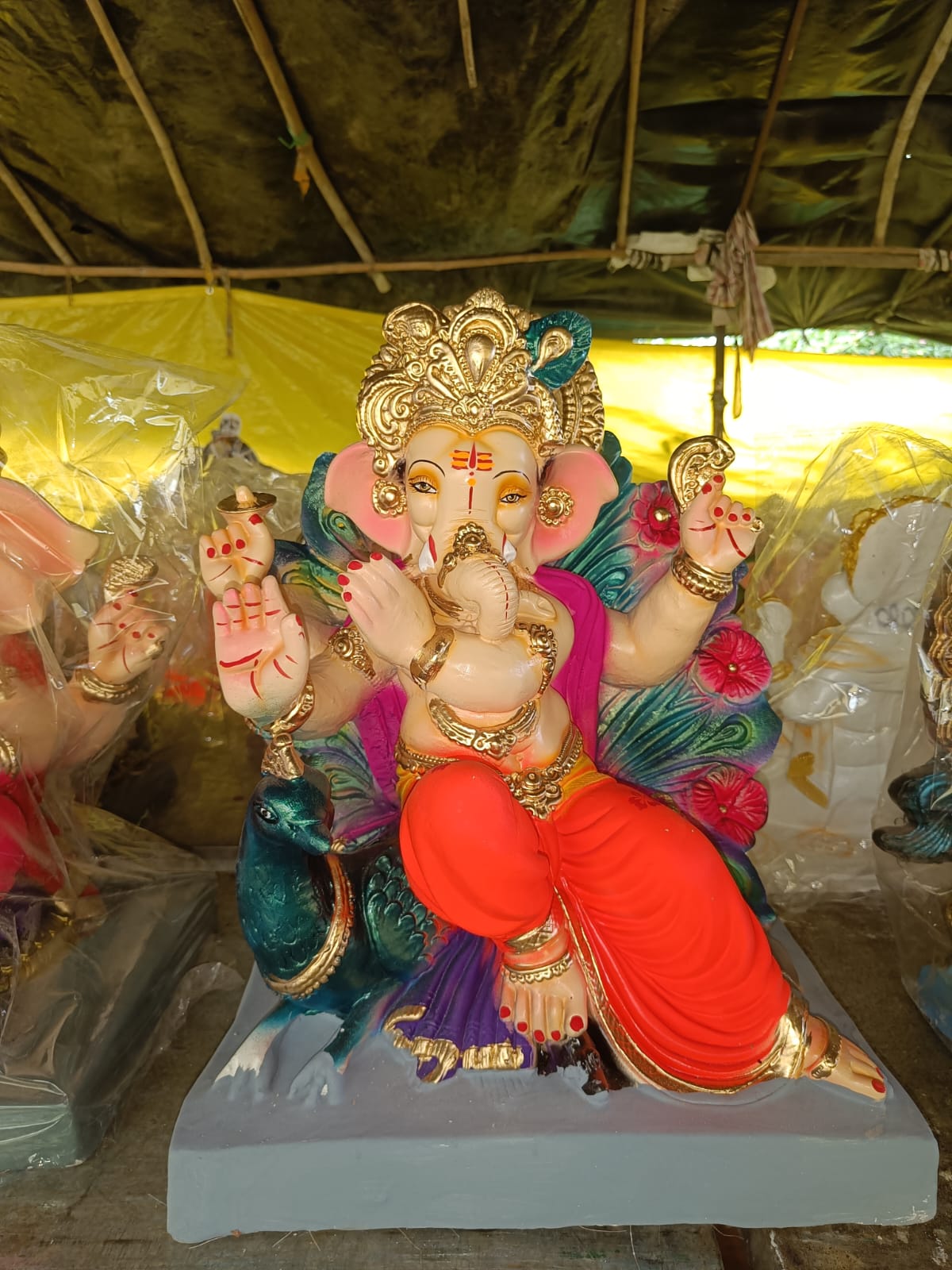 Divine 1.5 Foot Mayurasan Ganesha Idol in Bright Orange Dhoti | Handcrafted Peacock Throne Ganpati Murti